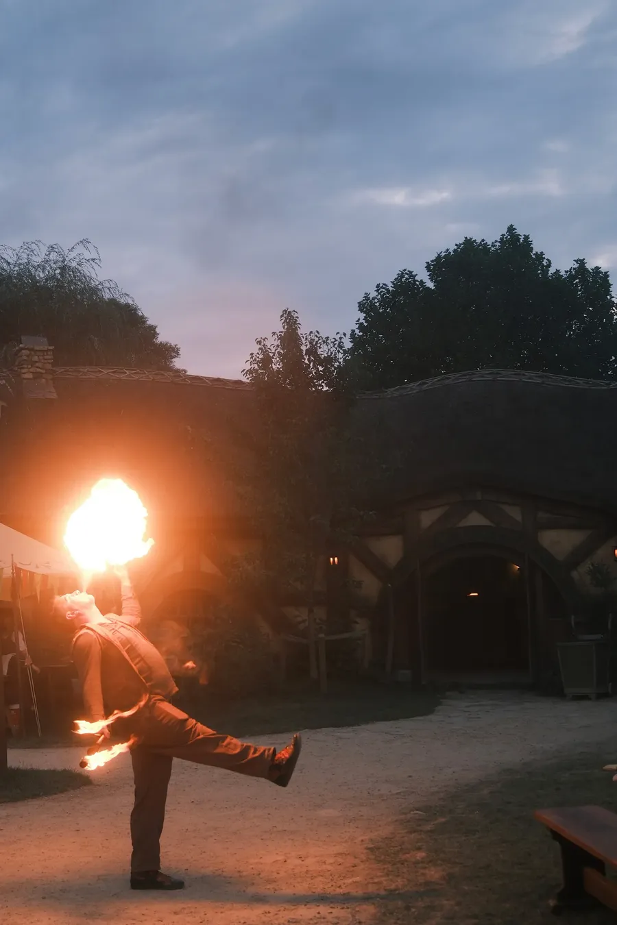 A fire performer at night.