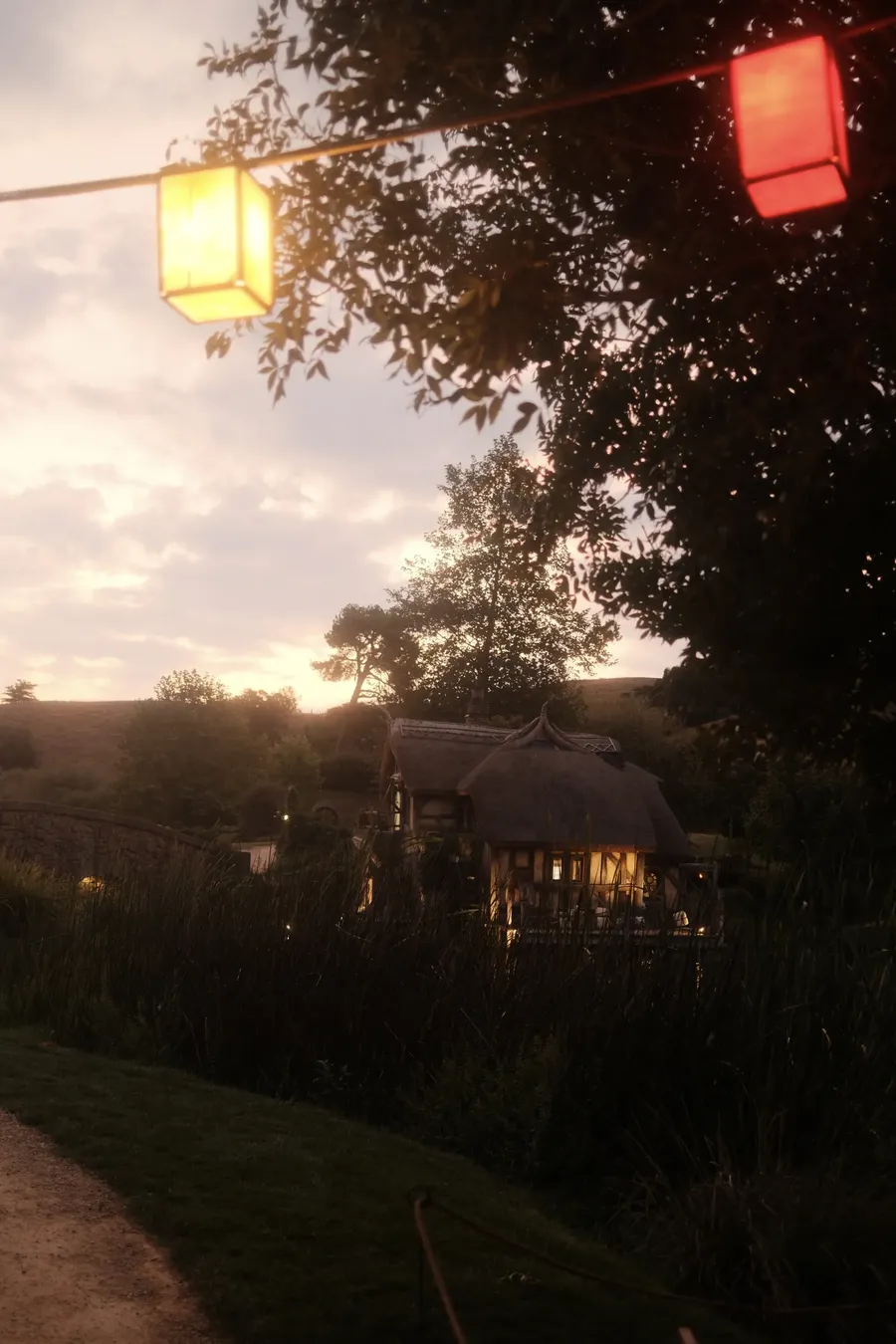 Paper lanterns under a dusk sky.