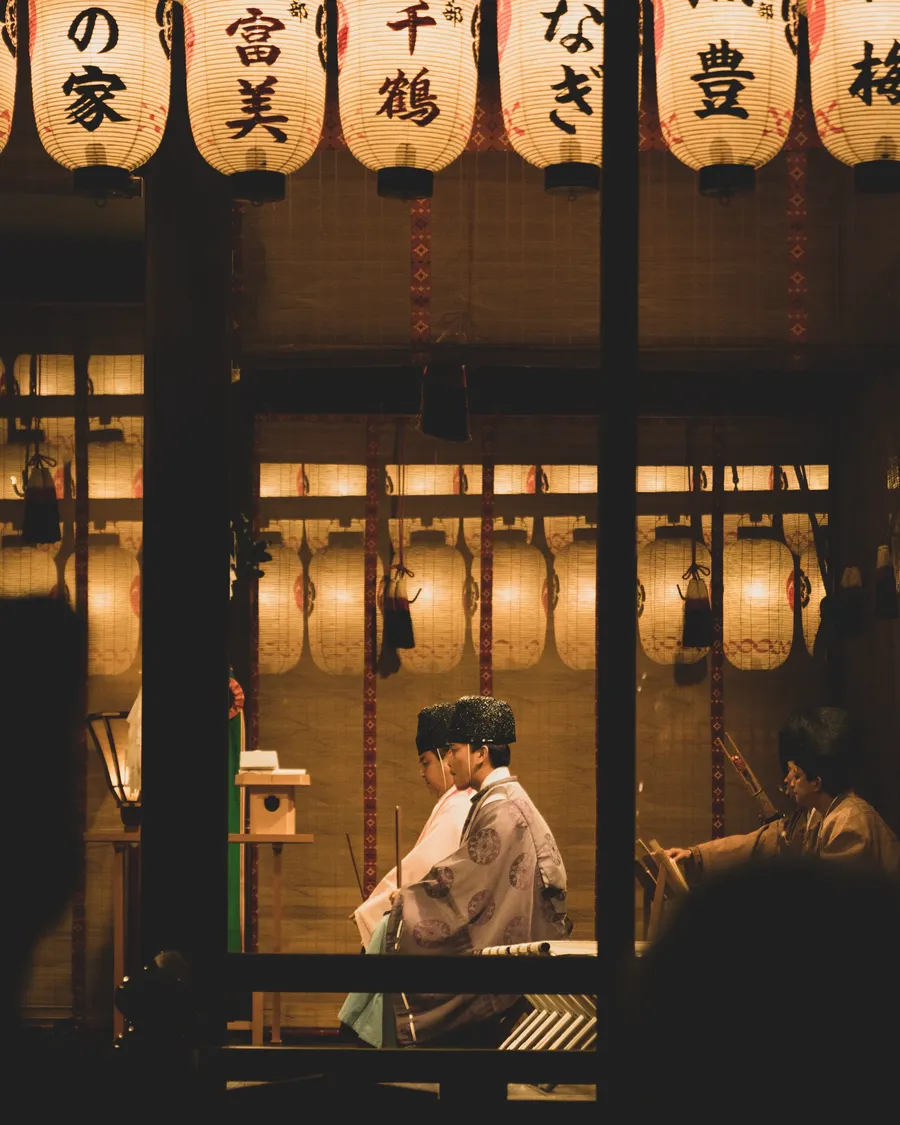 The lit window of a restaurant, seen from the street.