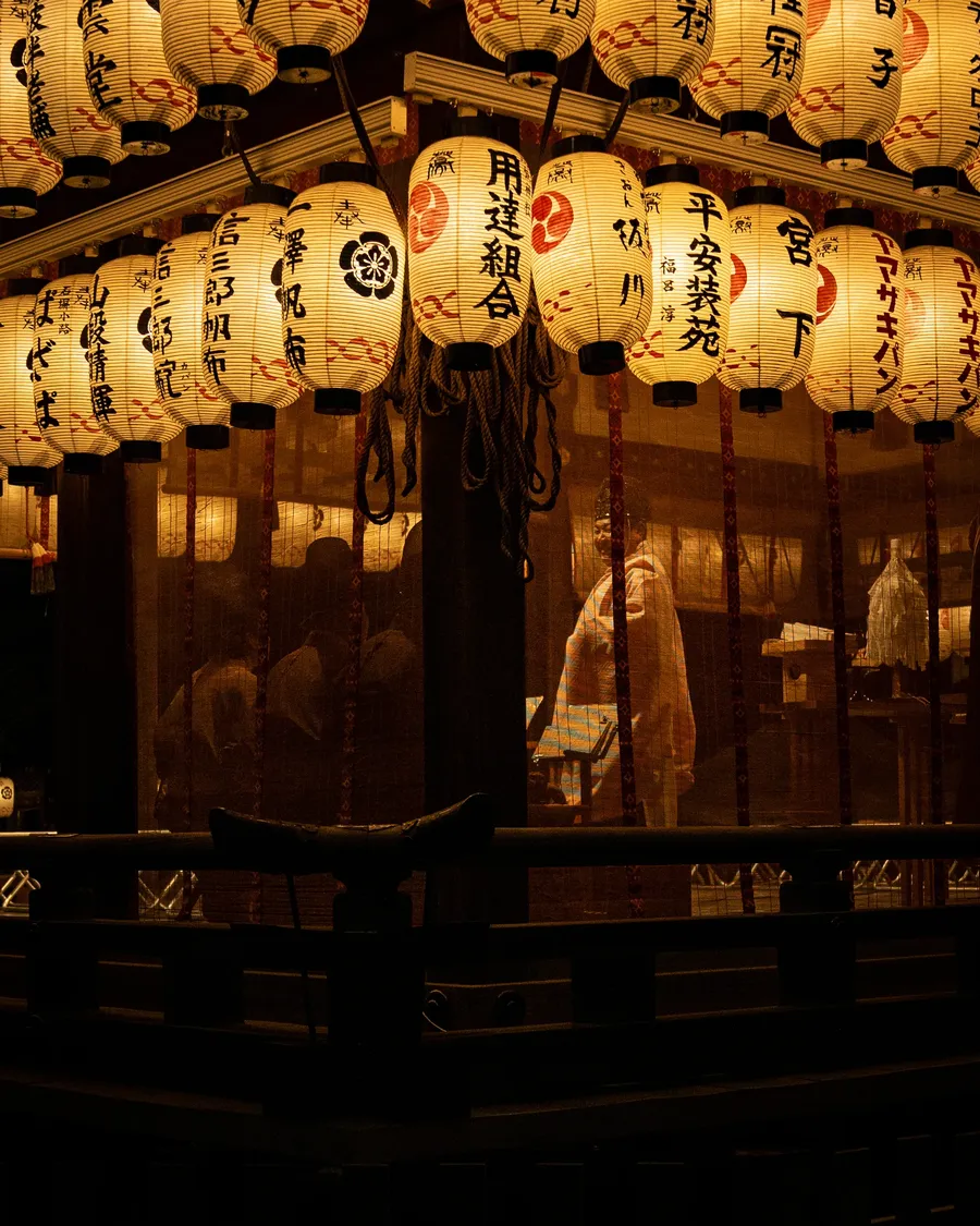 Paper lanterns hanging inside a shrine.